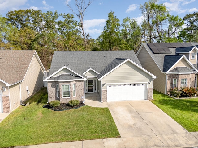 406 Pritchard St, Myrtle Beach, SC 29588 - ranch-style house with brick siding, a garage, driveway, and a front yard