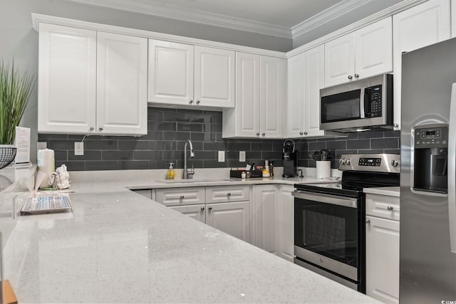 4861 Luster Leaf Cir Unit 104, Myrtle Beach, SC 29577 - kitchen with stainless steel appliances, a sink, crown molding, white cabinetry, and tasteful backsplash