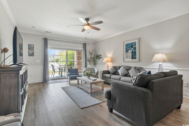 4861 Luster Leaf Cir Unit 104, Myrtle Beach, SC 29577 - living room with ceiling fan, wood finished floors, crown molding, and a wainscoted wall