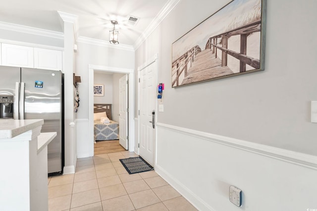 4861 Luster Leaf Cir Unit 104, Myrtle Beach, SC 29577 - entryway featuring light tile patterned floors and ornamental molding