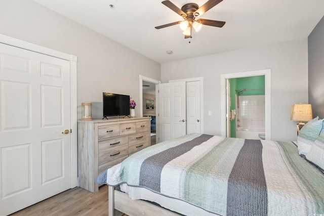 4861 Luster Leaf Cir Unit 104, Myrtle Beach, SC 29577 - bedroom with light wood-type flooring, ensuite bath, and ceiling fan