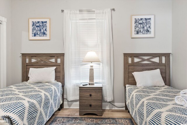 4861 Luster Leaf Cir Unit 104, Myrtle Beach, SC 29577 - bedroom with wood finished floors and baseboards