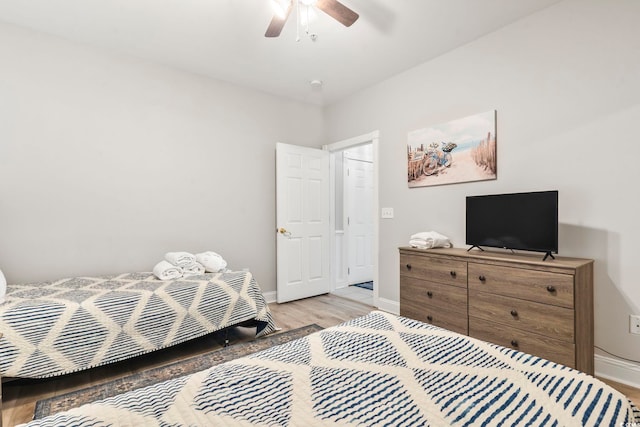 4861 Luster Leaf Cir Unit 104, Myrtle Beach, SC 29577 - bedroom featuring light wood finished floors, baseboards, and a ceiling fan