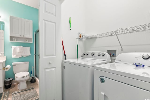 4861 Luster Leaf Cir Unit 104, Myrtle Beach, SC 29577 - clothes washing area featuring washing machine and dryer and tile patterned floors
