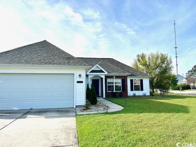 232 Marbella Dr, Murrells Inlet, SC 29576 - ranch-style house featuring concrete driveway, a front lawn, a garage, and roof with shingles