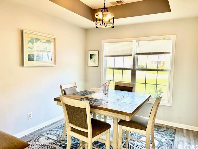 232 Marbella Dr, Murrells Inlet, SC 29576 - dining room with wood finished floors and baseboards
