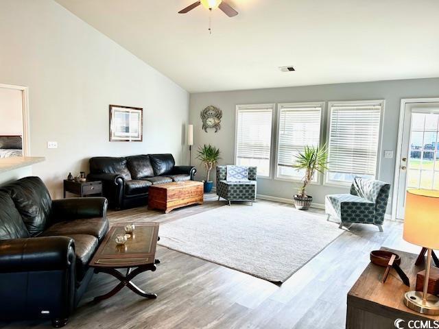 232 Marbella Dr, Murrells Inlet, SC 29576 - living room with wood finished floors, lofted ceiling, a ceiling fan, and baseboards