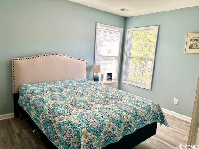 232 Marbella Dr, Murrells Inlet, SC 29576 - bedroom featuring wood finished floors and baseboards
