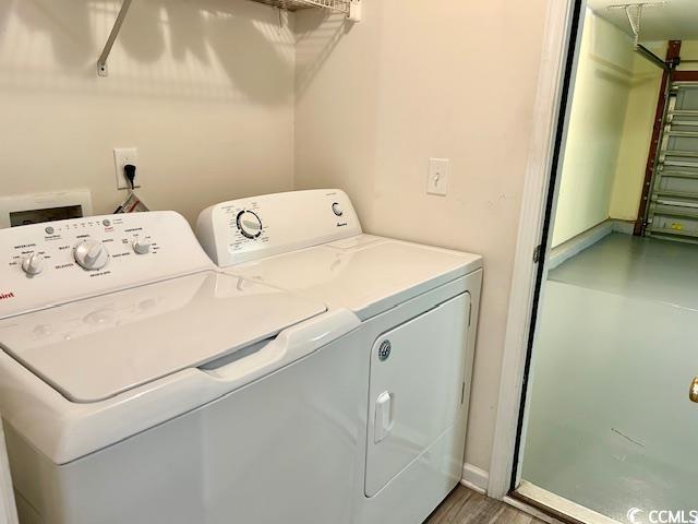232 Marbella Dr, Murrells Inlet, SC 29576 - clothes washing area with washer and dryer and wood finished floors