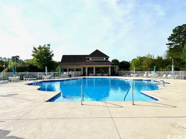 232 Marbella Dr, Murrells Inlet, SC 29576 - community pool with fence and a patio area