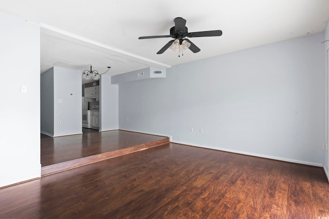 unfurnished room featuring visible vents, ceiling fan, wood finished floors, and baseboards