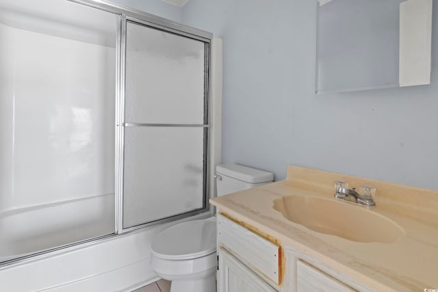 full bathroom with toilet, vanity, and combined bath / shower with glass door