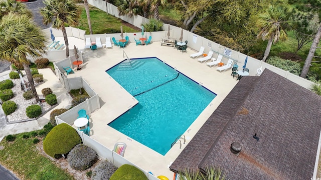 pool featuring a patio and a fenced backyard