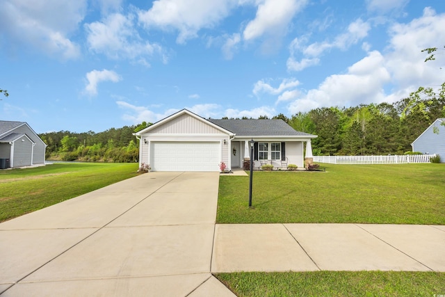 1340 Valor Rd, Conway, SC 29527 - view of front facade with a garage, driveway, board and batten siding, and central AC unit