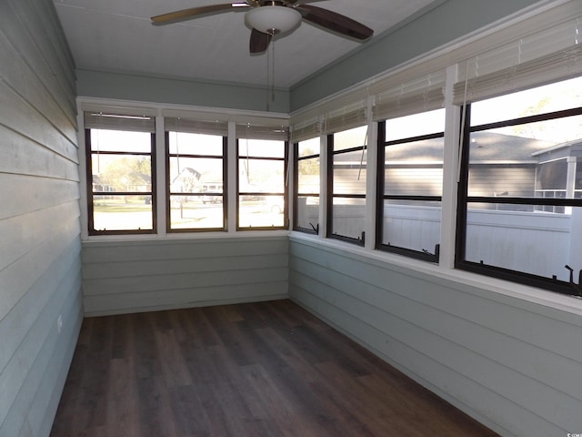 1208 Mackie Cir, Myrtle Beach, SC 29579 - unfurnished sunroom featuring a ceiling fan, wood finished floors, and wood walls