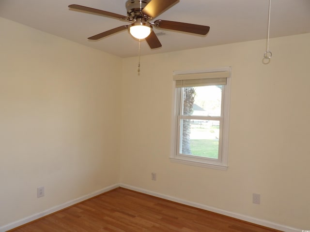1208 Mackie Cir, Myrtle Beach, SC 29579 - unfurnished room with wood finished floors, baseboards, and a ceiling fan
