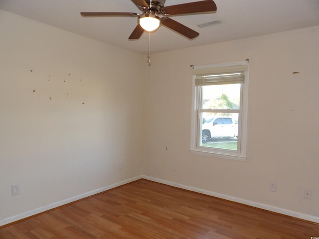 1208 Mackie Cir, Myrtle Beach, SC 29579 - spare room with wood finished floors, ceiling fan, and baseboards