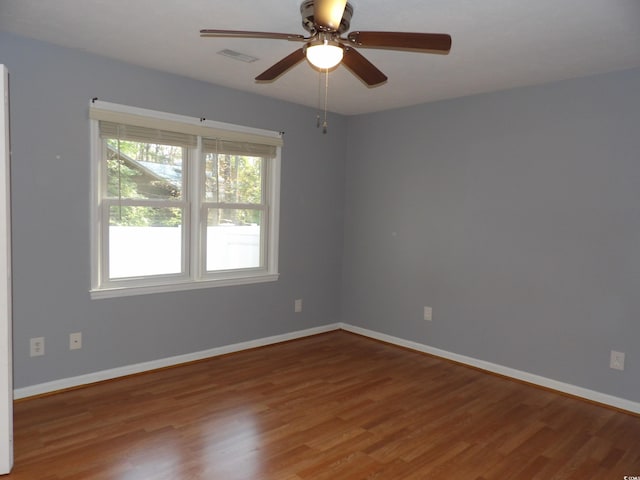 1208 Mackie Cir, Myrtle Beach, SC 29579 - empty room featuring wood finished floors, baseboards, and a ceiling fan