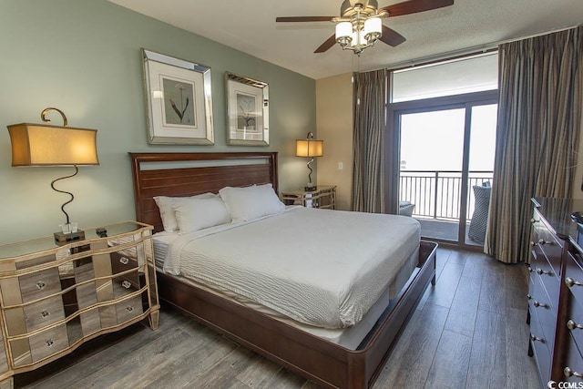 bedroom featuring access to outside, a ceiling fan, and wood finished floors