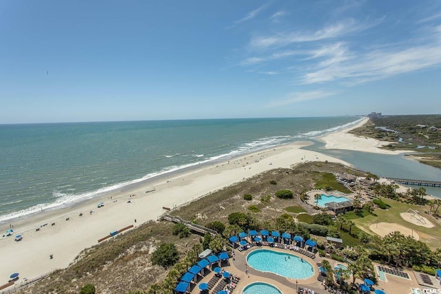 drone / aerial view with a water view and a view of the beach