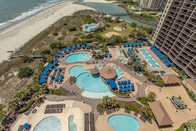 aerial view with a beach view and a water view
