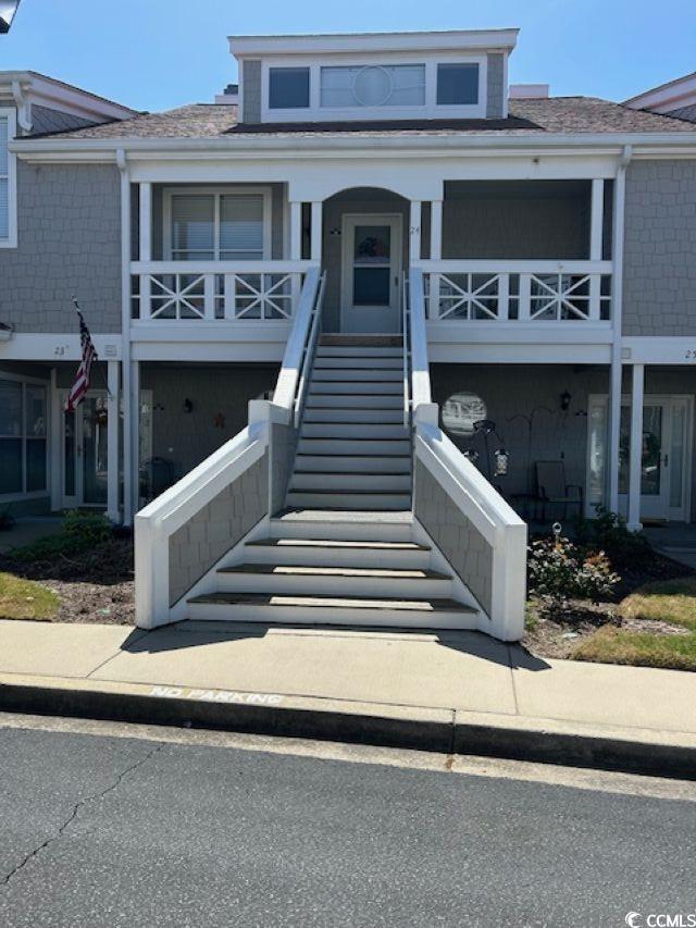 4396 Baldwin Ave Unit C-24, Little River, SC 29566 - view of front of home with stairway and roof with shingles