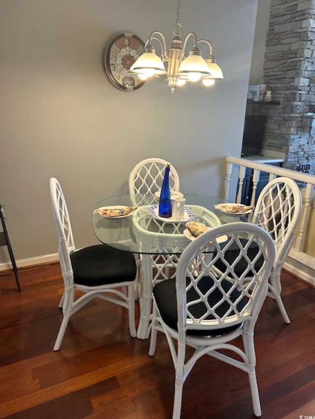 4396 Baldwin Ave Unit C-24, Little River, SC 29566 - dining space with a chandelier, wood finished floors, and baseboards