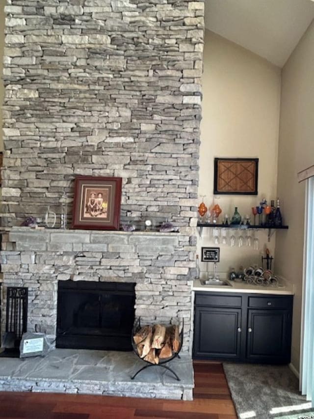 4396 Baldwin Ave Unit C-24, Little River, SC 29566 - detailed view of wet bar, wood finished floors, and a stone fireplace