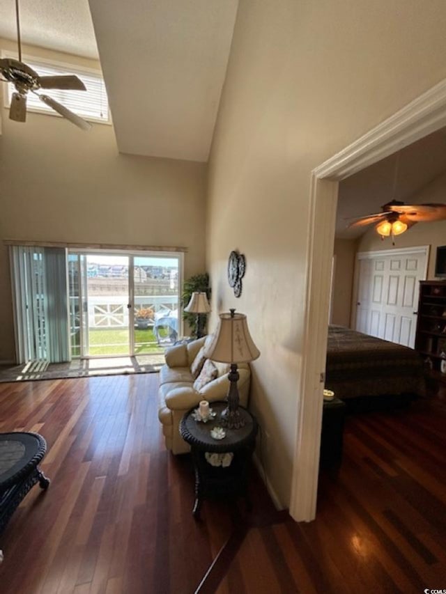 4396 Baldwin Ave Unit C-24, Little River, SC 29566 - living area featuring a ceiling fan, a towering ceiling, and wood finished floors
