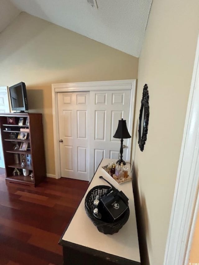 4396 Baldwin Ave Unit C-24, Little River, SC 29566 - bedroom with vaulted ceiling, dark wood-type flooring, and a closet