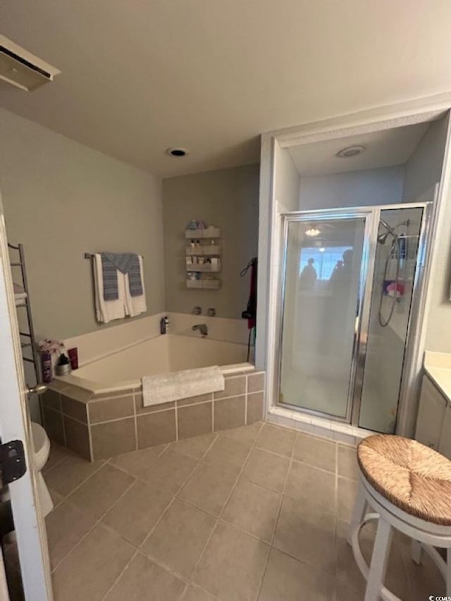 4396 Baldwin Ave Unit C-24, Little River, SC 29566 - bathroom featuring tile patterned flooring, a shower stall, a bath, toilet, and vanity