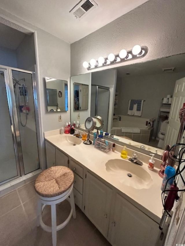4396 Baldwin Ave Unit C-24, Little River, SC 29566 - bathroom with a stall shower, double vanity, tile patterned flooring, and a bathtub