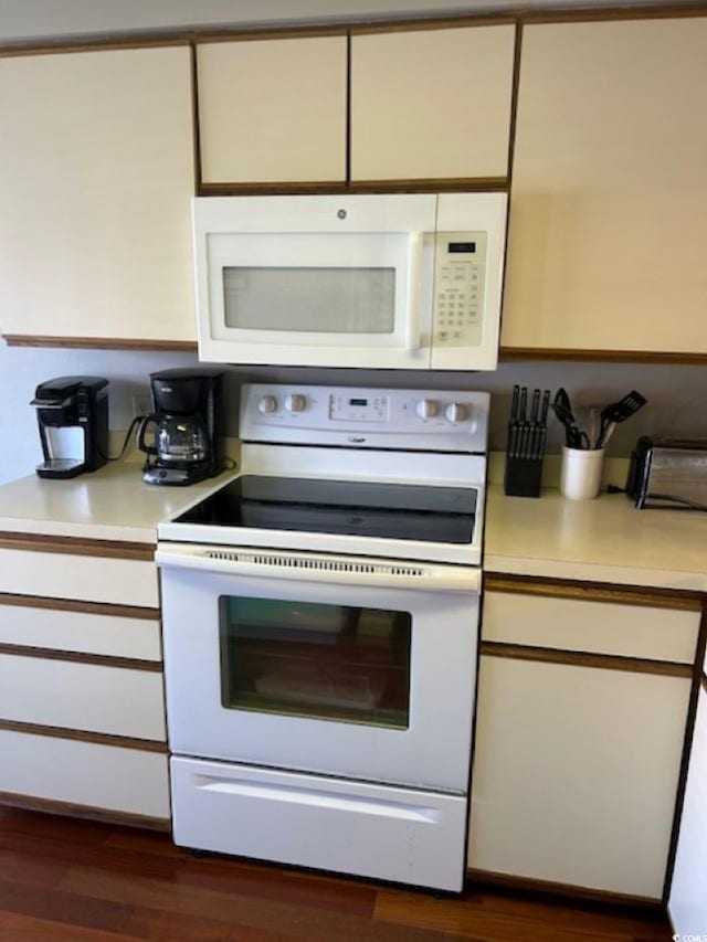 4396 Baldwin Ave Unit C-24, Little River, SC 29566 - kitchen featuring white appliances, light countertops, and dark wood-style floors