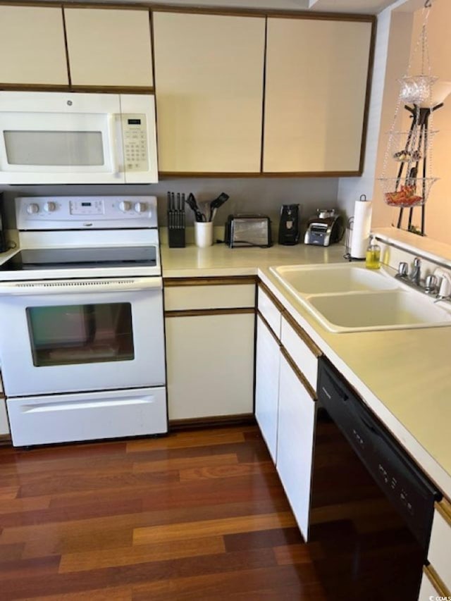 4396 Baldwin Ave Unit C-24, Little River, SC 29566 - kitchen featuring white appliances, a sink, light countertops, white cabinets, and dark wood-style floors