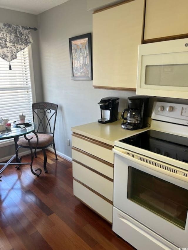 4396 Baldwin Ave Unit C-24, Little River, SC 29566 - kitchen featuring white appliances, light countertops, dark wood finished floors, and baseboards