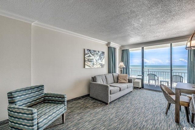 1105 S Ocean Blvd Unit 502, Myrtle Beach, SC 29577 - carpeted living room with a water view, floor to ceiling windows, a textured ceiling, and crown molding