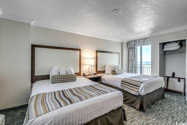 1105 S Ocean Blvd Unit 502, Myrtle Beach, SC 29577 - bedroom with crown molding and a textured ceiling