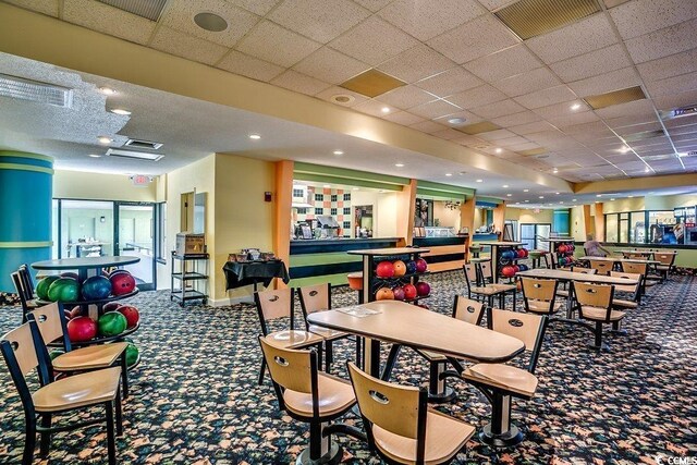 1105 S Ocean Blvd Unit 502, Myrtle Beach, SC 29577 - rec room featuring carpet floors, a paneled ceiling, and recessed lighting