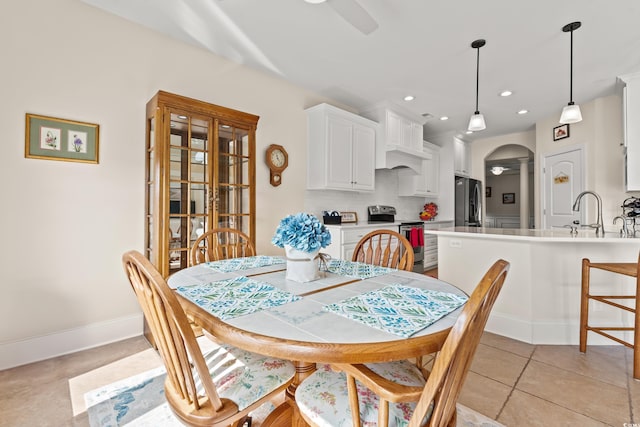 2039 Woodburn Dr, Myrtle Beach, SC 29579 - dining room featuring arched walkways, ceiling fan, light tile patterned floors, baseboards, and recessed lighting