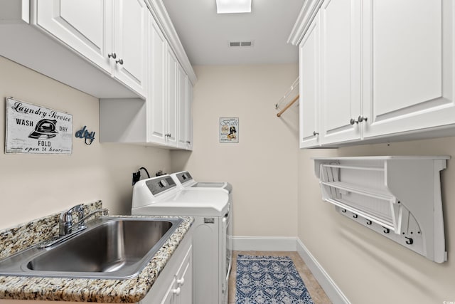 2039 Woodburn Dr, Myrtle Beach, SC 29579 - washroom featuring independent washer and dryer, baseboards, and cabinet space