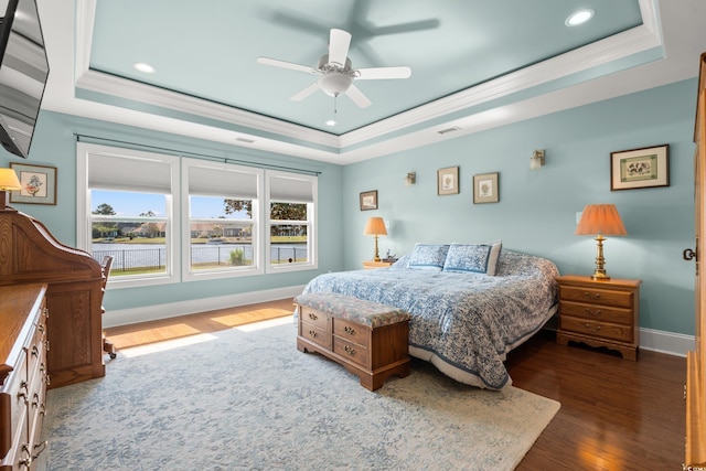 2039 Woodburn Dr, Myrtle Beach, SC 29579 - bedroom with a tray ceiling, wood finished floors, baseboards, ornamental molding, and recessed lighting