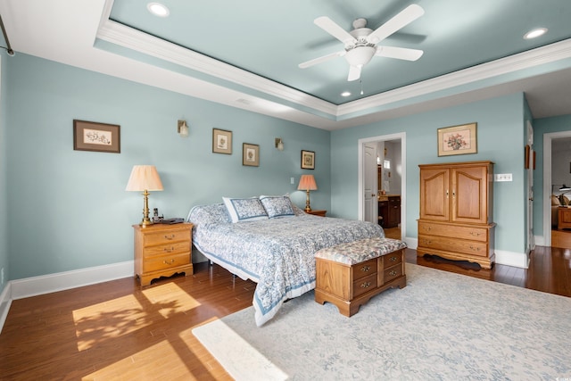 2039 Woodburn Dr, Myrtle Beach, SC 29579 - bedroom featuring a tray ceiling, recessed lighting, baseboards, ornamental molding, and wood finished floors