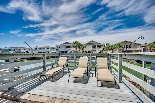 wooden deck featuring a residential view