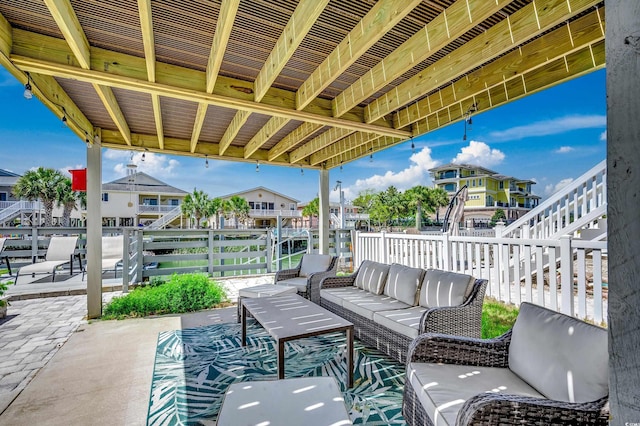 view of patio featuring a residential view, outdoor lounge area, and fence
