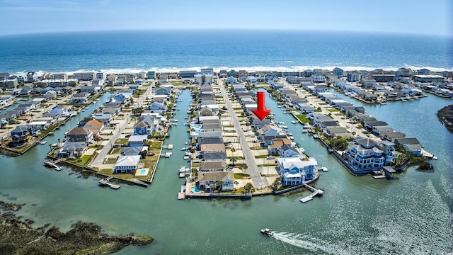 birds eye view of property featuring a residential view and a water view