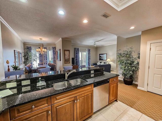 kitchen featuring visible vents, dishwasher, a sink, open floor plan, and brown cabinetry