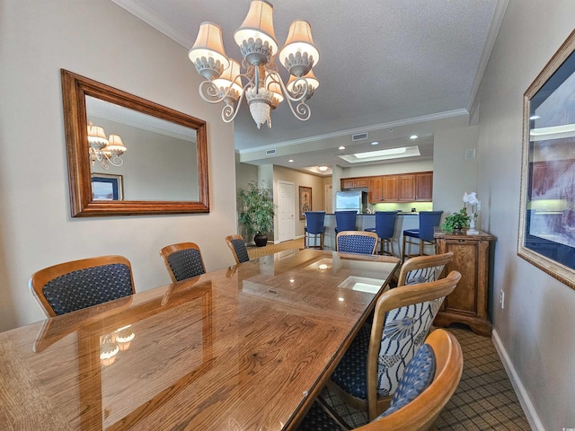 carpeted dining area with ornamental molding, baseboards, a notable chandelier, and visible vents