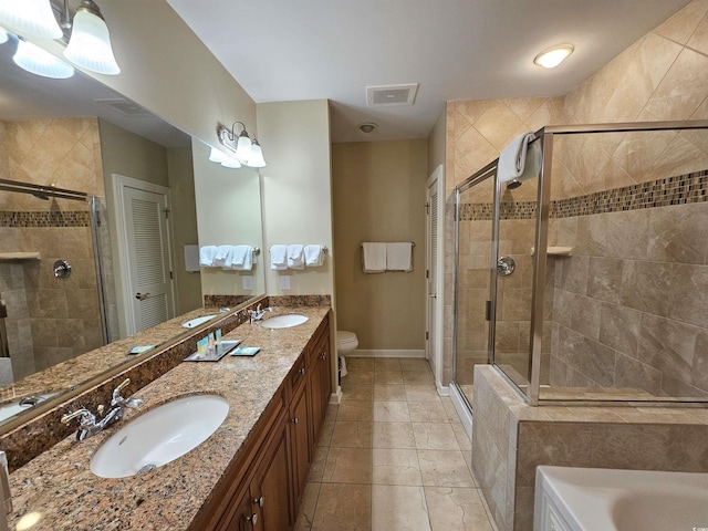 bathroom featuring a stall shower and a sink