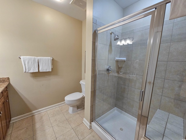 full bath with baseboards, toilet, vanity, tile patterned floors, and a stall shower