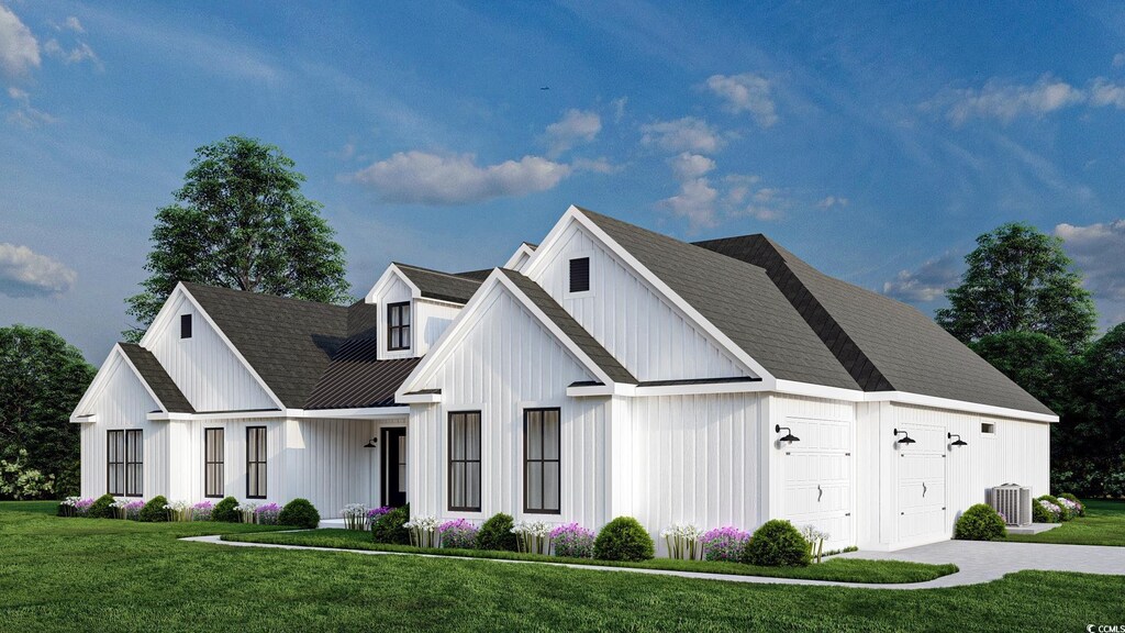 974 Crooked Oak Dr, Pawleys Island, SC 29585 - modern farmhouse style home with board and batten siding, a front lawn, central AC, a garage, and metal roof